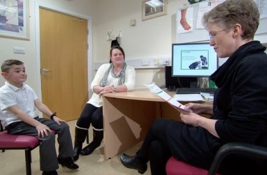 Dr Karen Horridge with a patient, Matthew and his mum